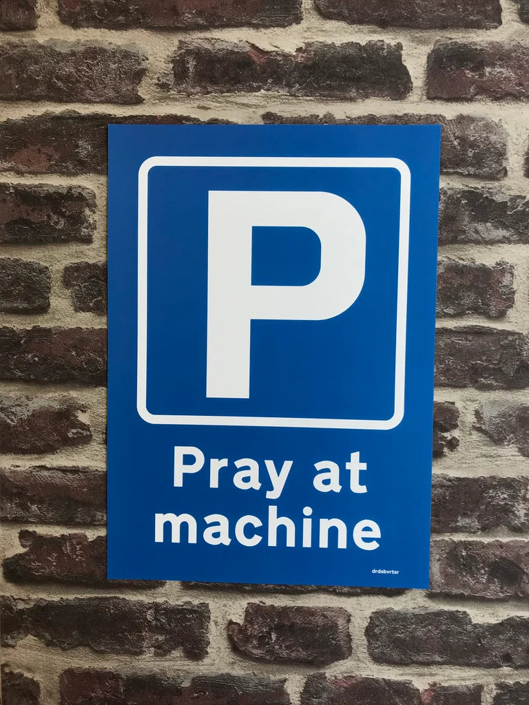 PRAY AT MACHINE ROAD SIGN