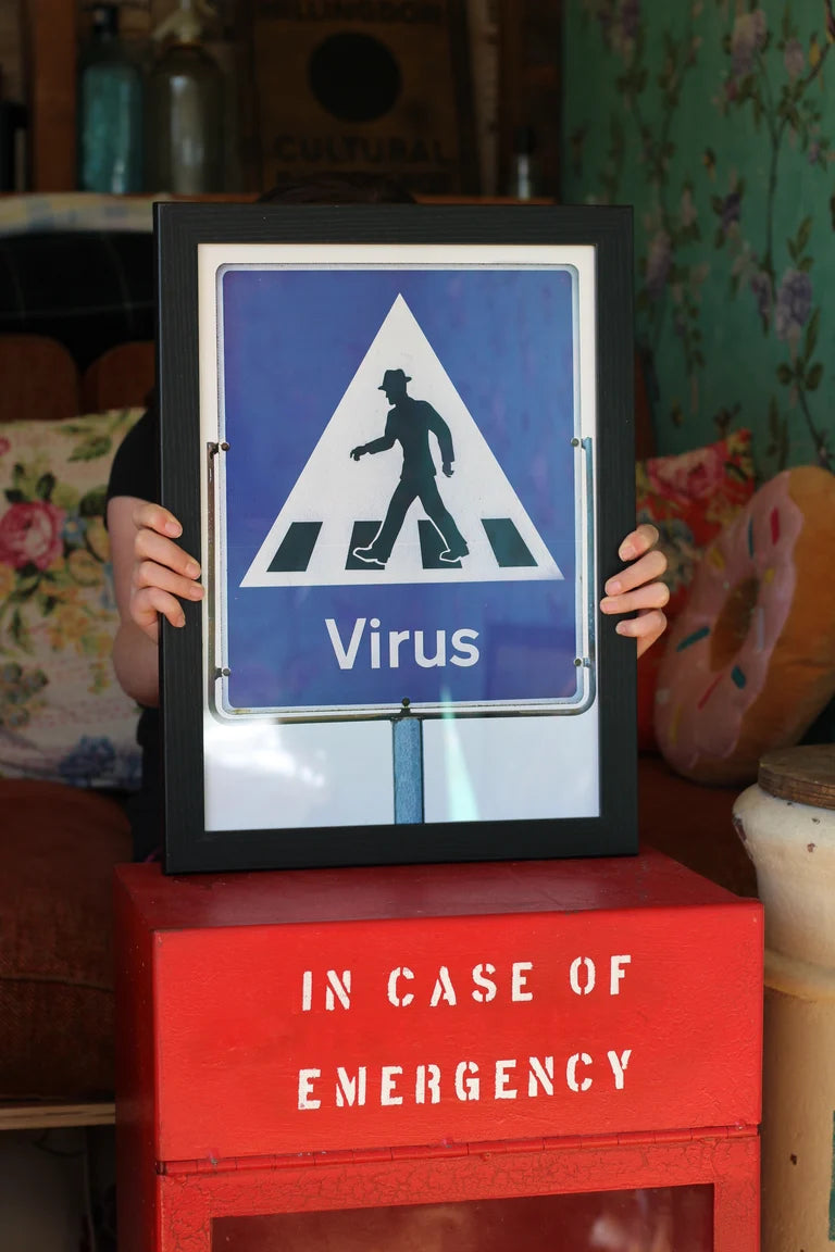 VIRUS WITH SHOES ROAD SIGN