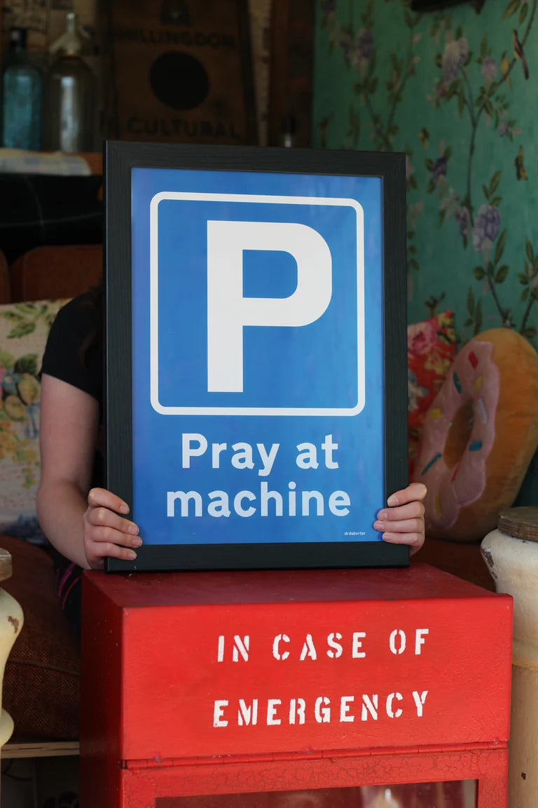 PRAY AT MACHINE ROAD SIGN